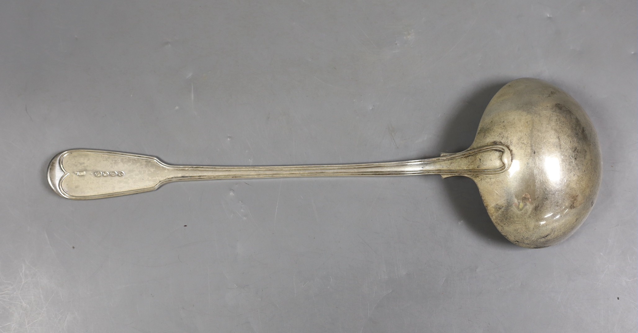 An early Victorian silver fiddle and thread pattern soup ladle, by William Eaton, London, 1845, 34.3cm